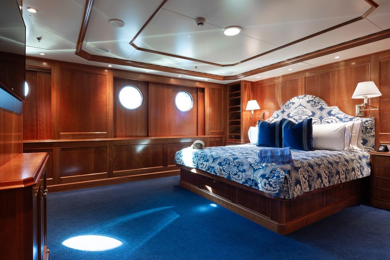 a bedroom with a large bed aboard CUPANI Yacht for Sale