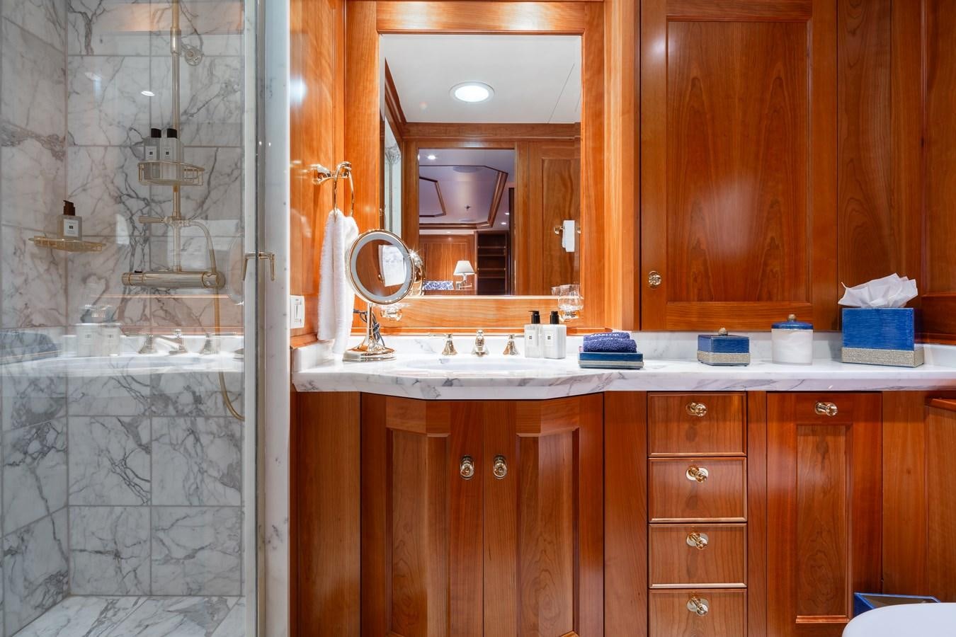 a bathroom with a glass shower aboard CUPANI Yacht for Sale