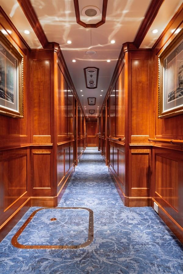 a large wooden hallway aboard CUPANI Yacht for Sale