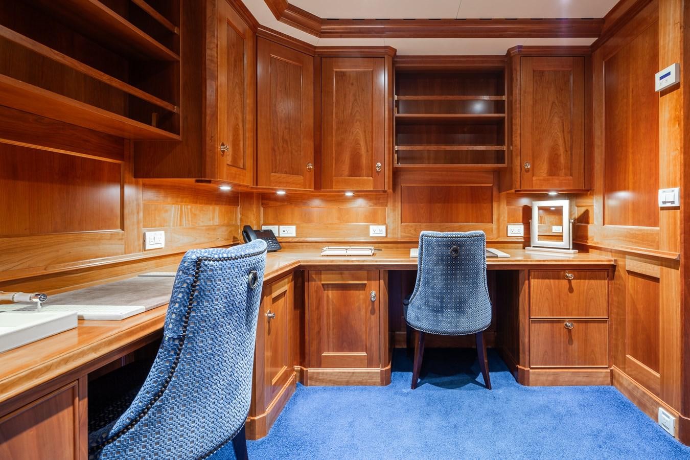 a chair in a kitchen aboard CUPANI Yacht for Sale