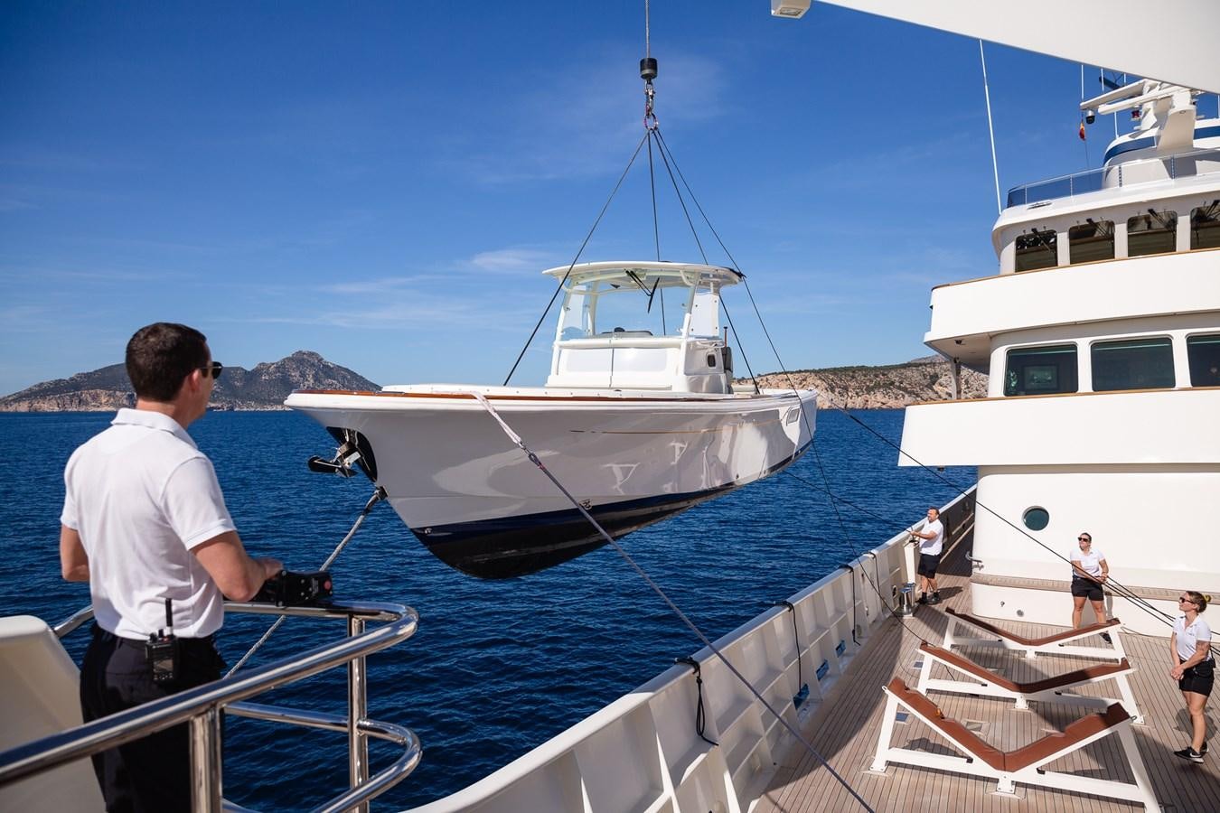 a person standing on a boat aboard CUPANI Yacht for Sale