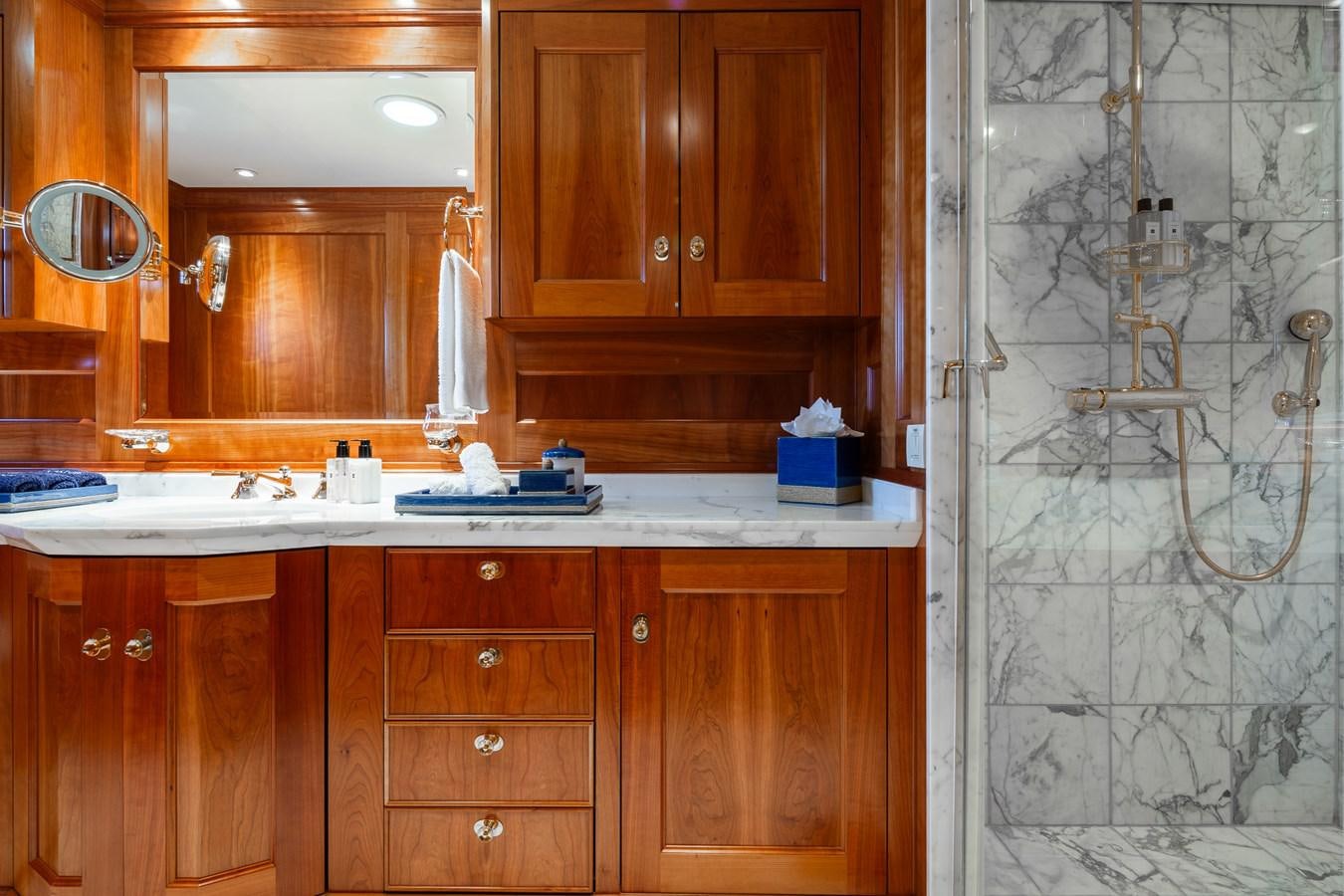 a kitchen with wooden cabinets aboard CUPANI Yacht for Sale