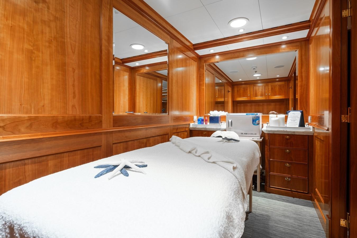 a bedroom with a laptop on the bed aboard CUPANI Yacht for Sale