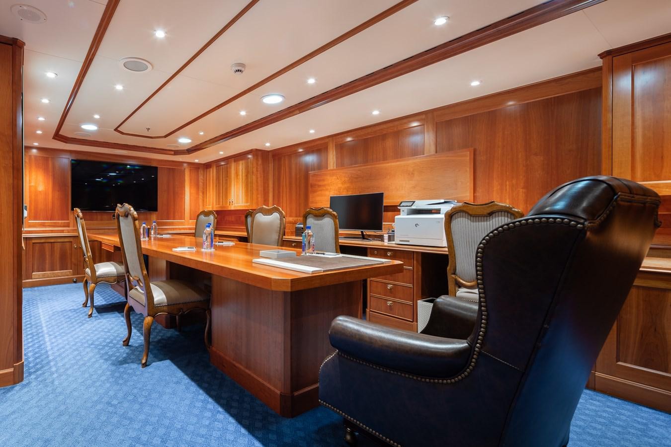 a room with a desk and chairs aboard CUPANI Yacht for Sale