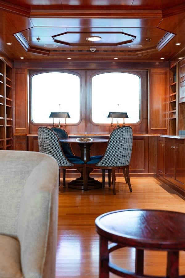 a room with a table and chairs aboard CUPANI Yacht for Sale