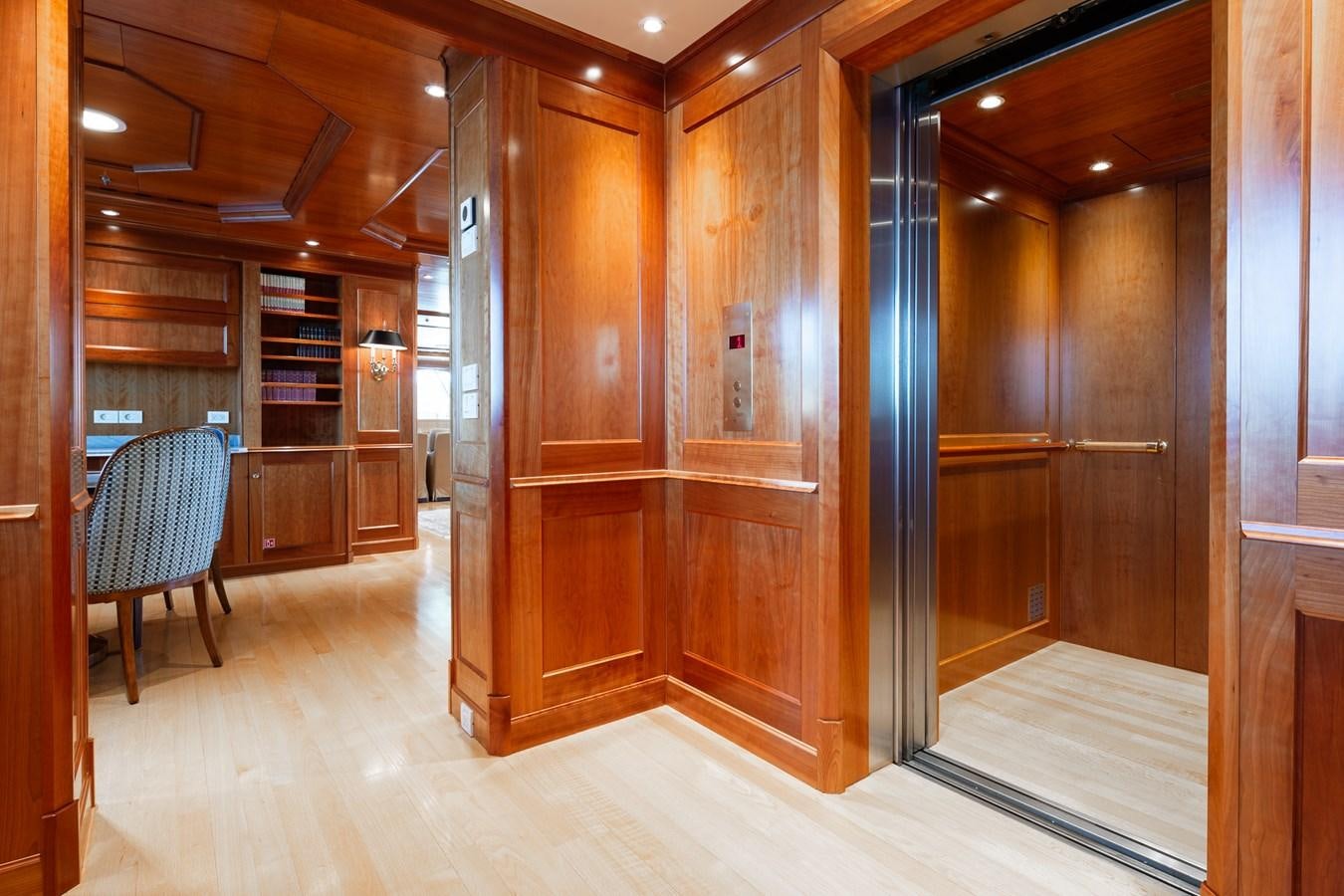 a room with wooden cabinets aboard CUPANI Yacht for Sale
