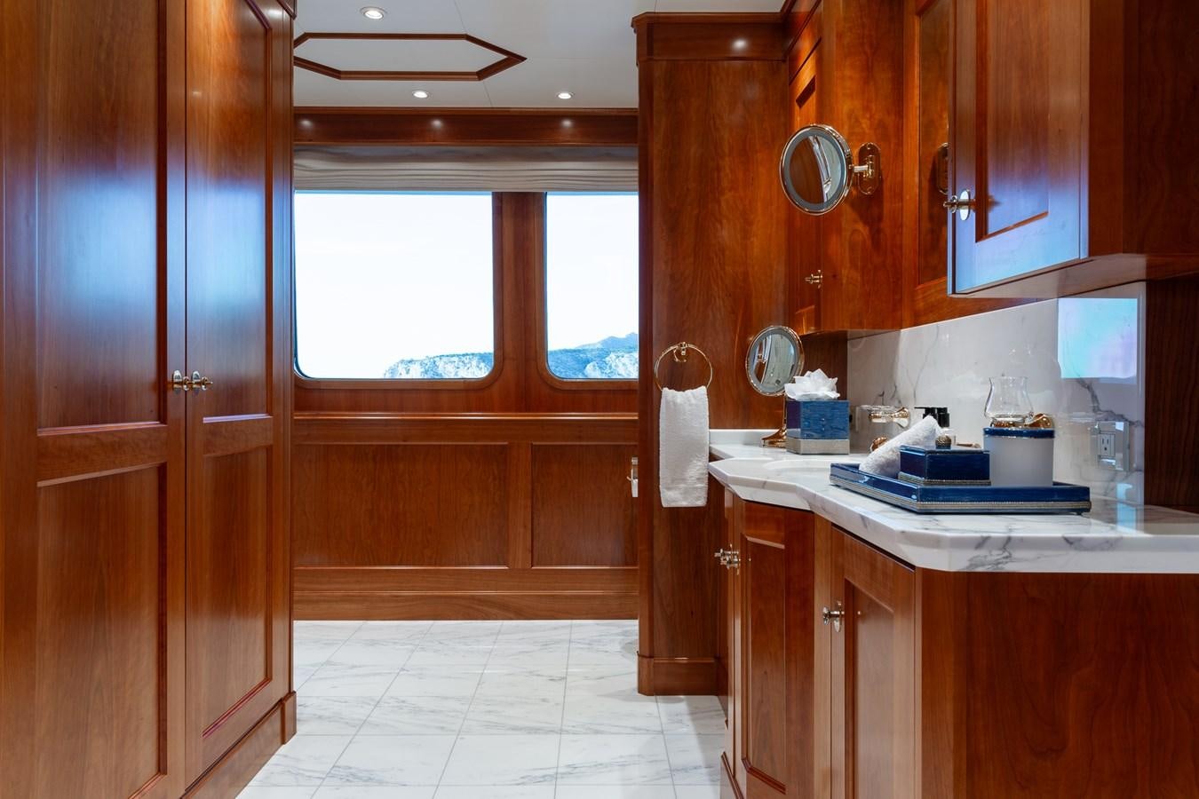 a kitchen with wooden cabinets aboard CUPANI Yacht for Sale