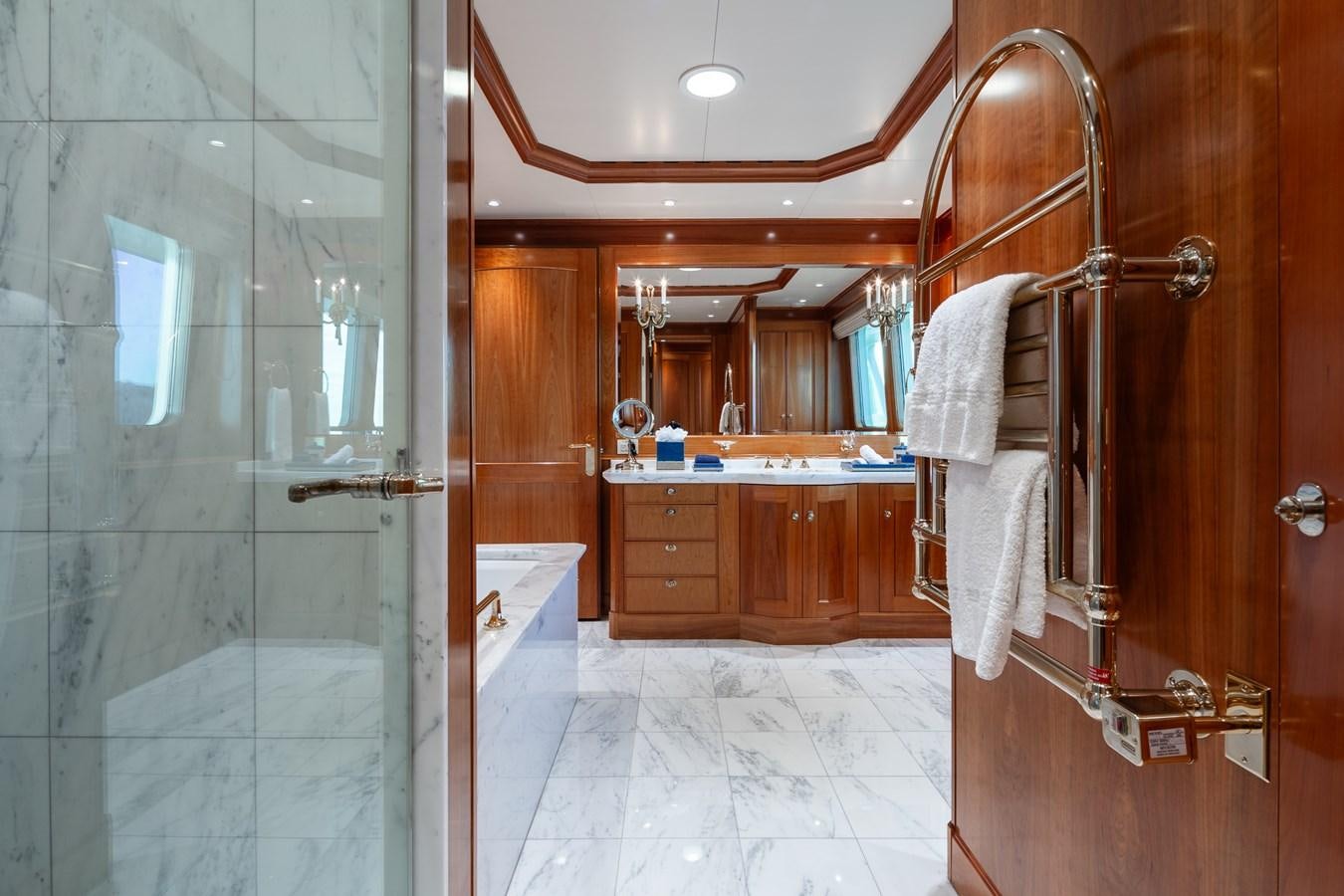 a bathroom with a shower and sink aboard CUPANI Yacht for Sale