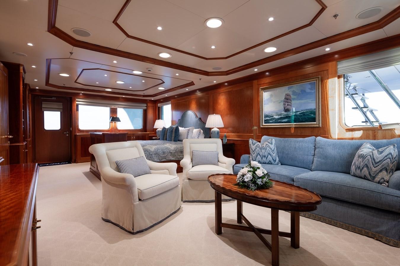a living room with a couch and a coffee table aboard CUPANI Yacht for Sale