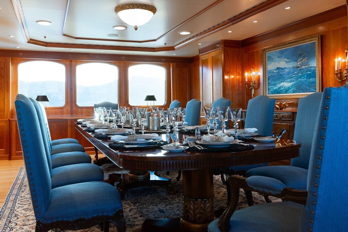 a dining room with a table and chairs aboard CUPANI Yacht for Sale