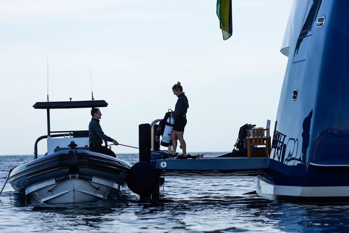 a couple of people on a boat aboard CUPANI Yacht for Sale