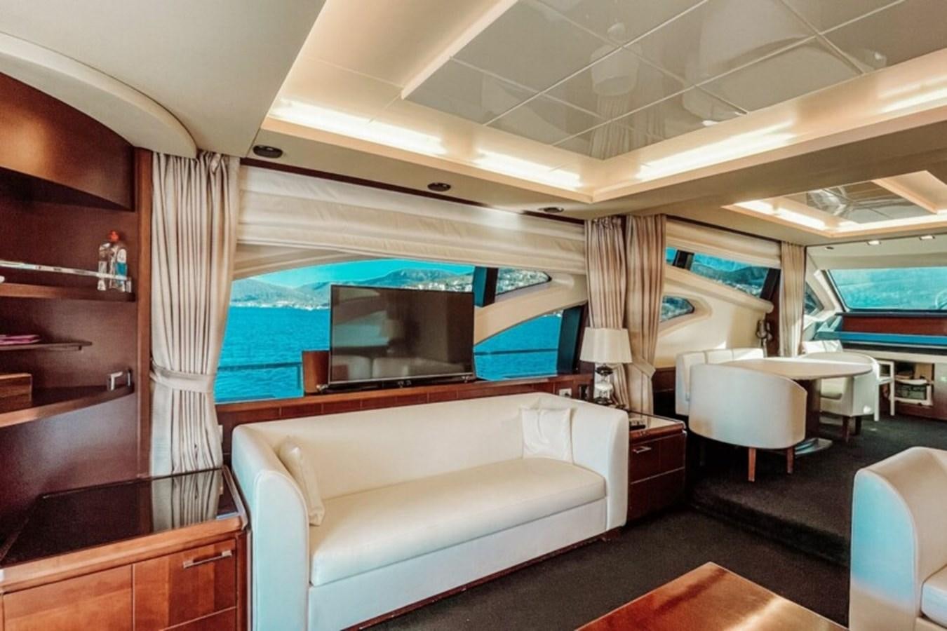 a room with a bed and a desk aboard C Yacht for Sale