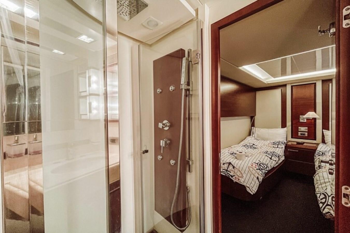 a room with a bed and a glass door aboard C Yacht for Sale