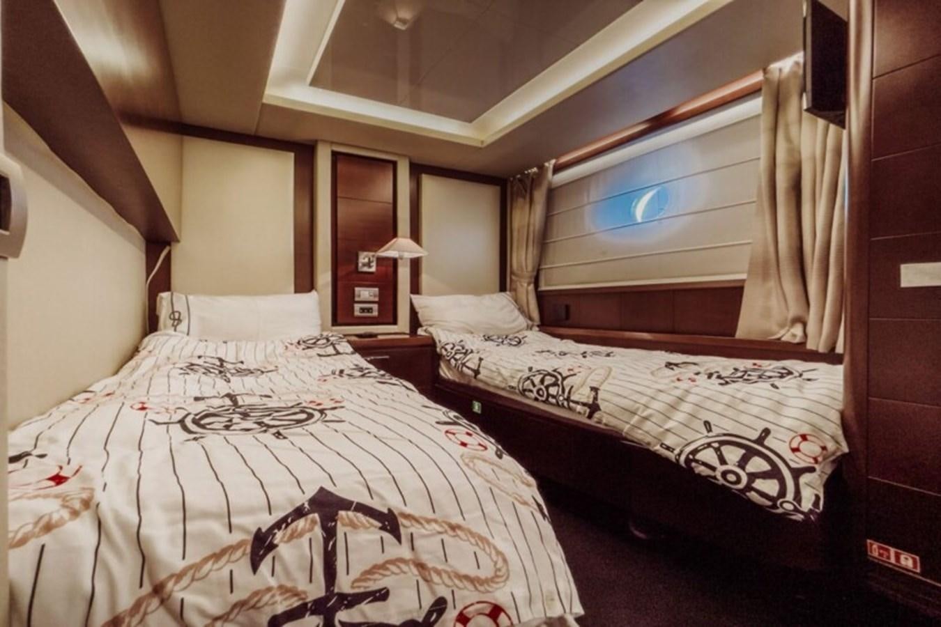 a couple of beds in a hotel room aboard C Yacht for Sale