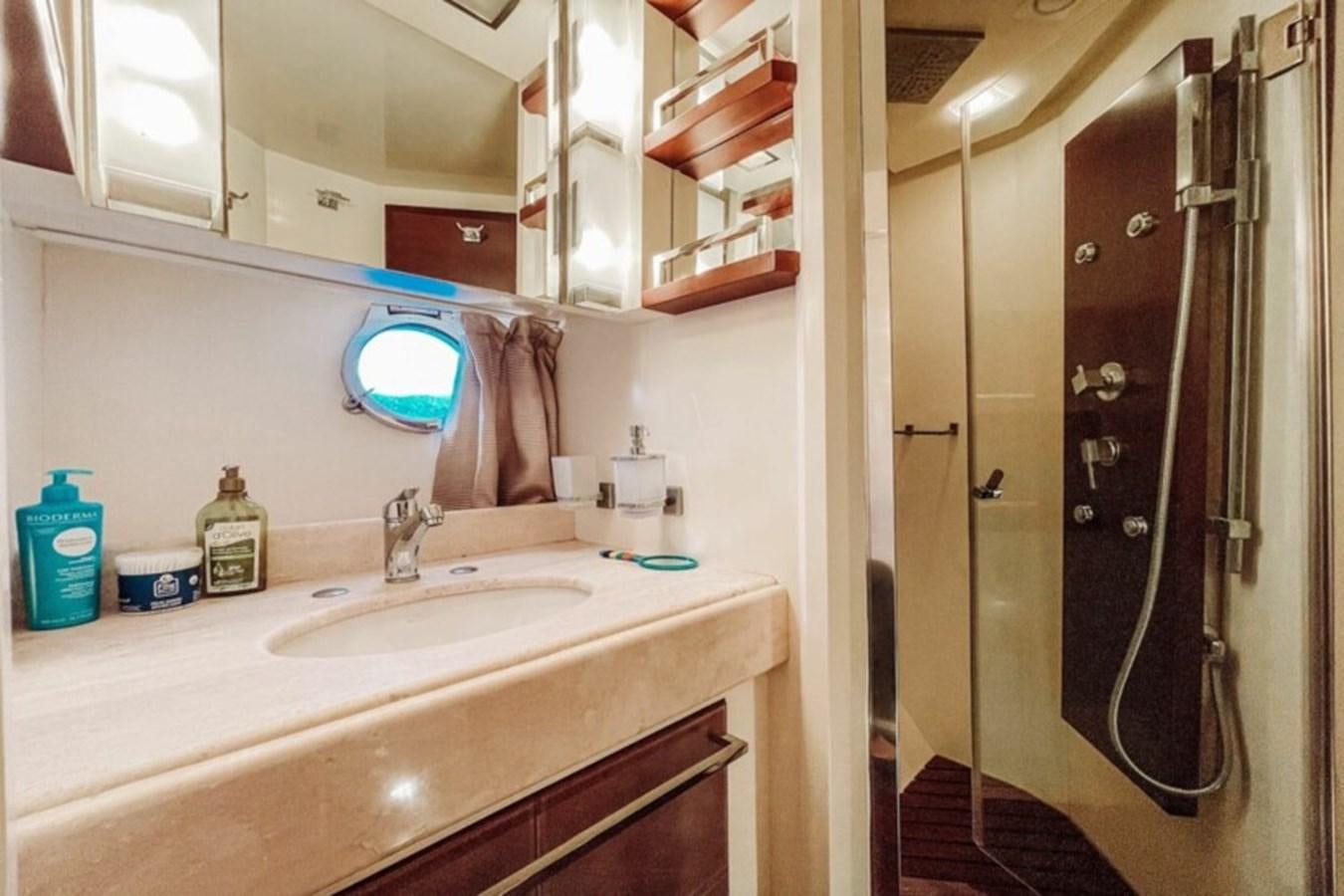 a bathroom with a sink and a shower unit aboard C Yacht for Sale