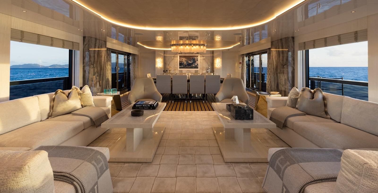 a large living room with a large window aboard ANCORA Yacht for Sale