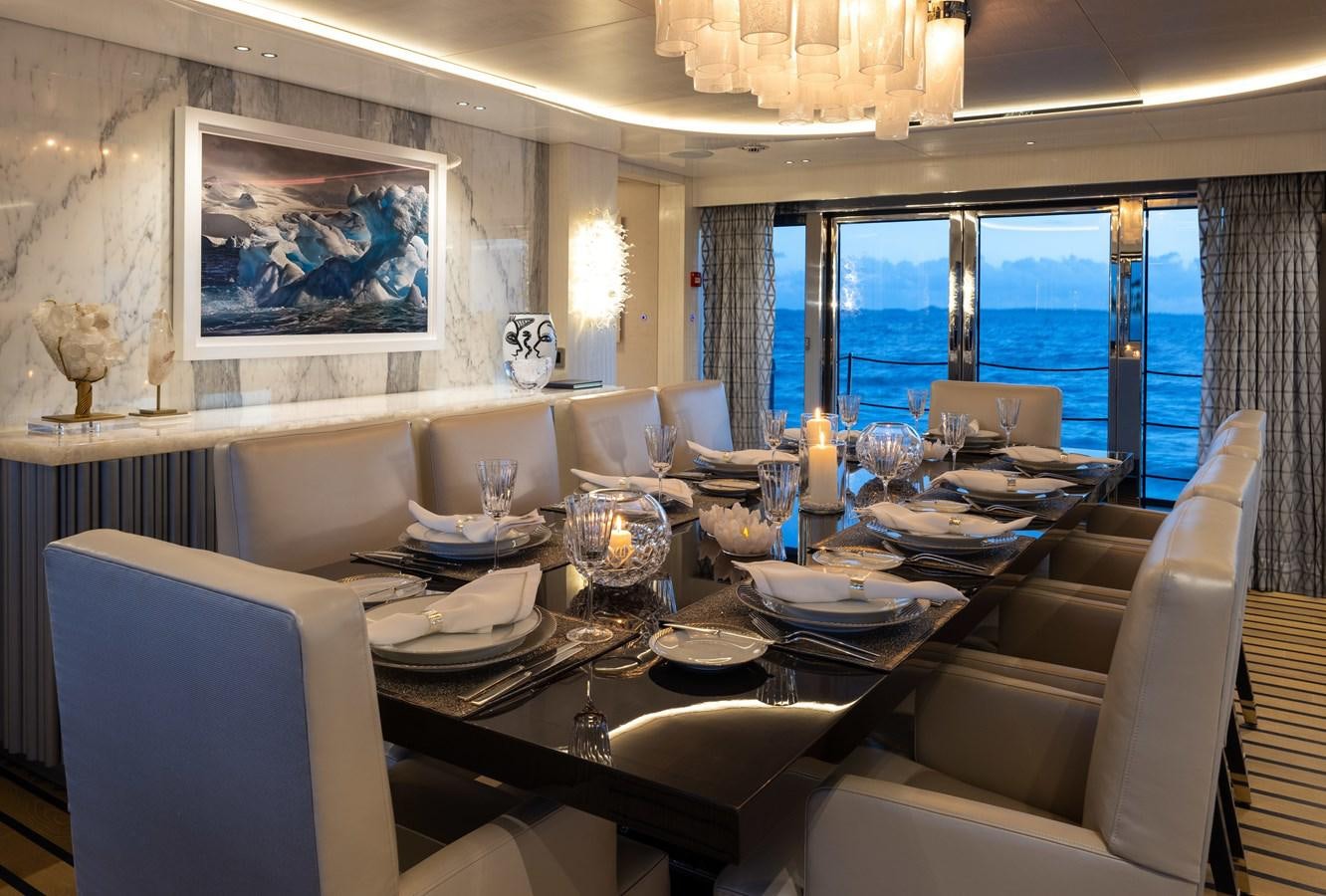 a dining room with a large table aboard ANCORA Yacht for Sale