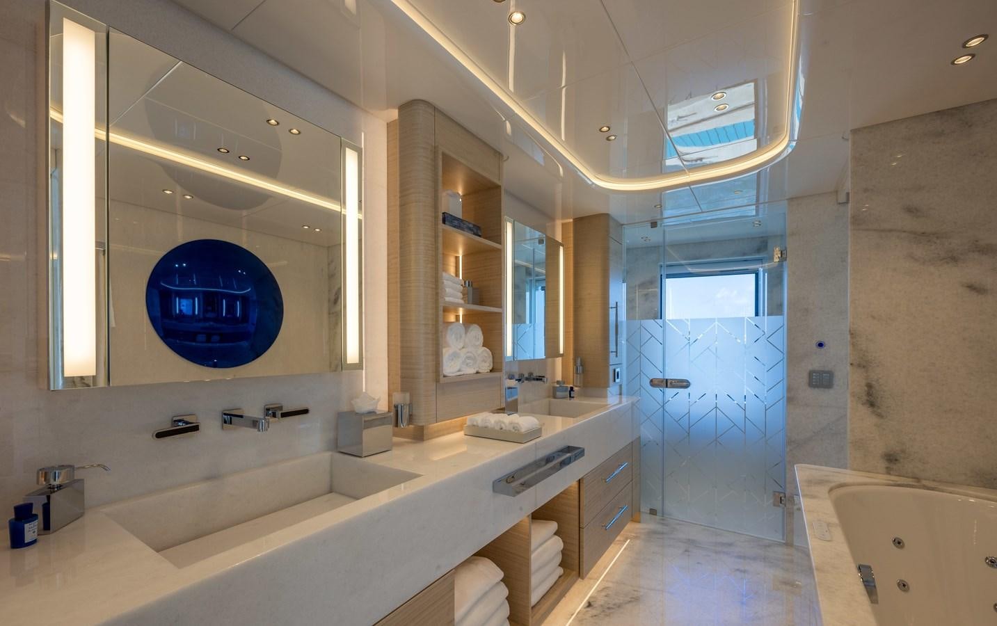 a bathroom with a large mirror aboard ANCORA Yacht for Sale
