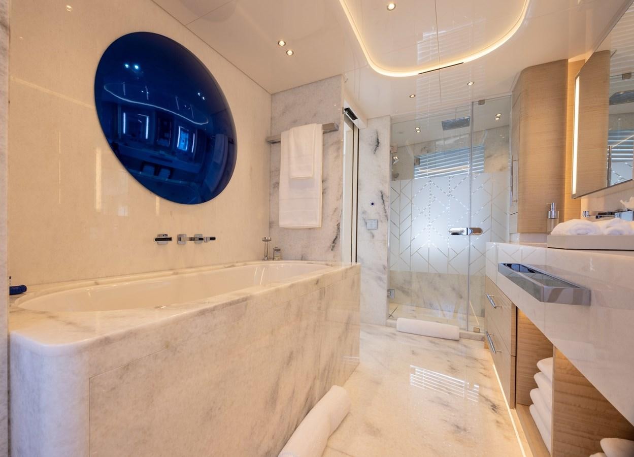 a bathroom with a bathtub and a sink aboard ANCORA Yacht for Sale