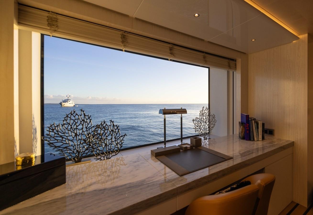 a room with a table and chairs aboard ANCORA Yacht for Sale