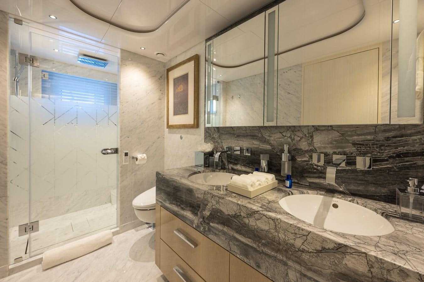a bathroom with a marble counter top aboard ANCORA Yacht for Sale