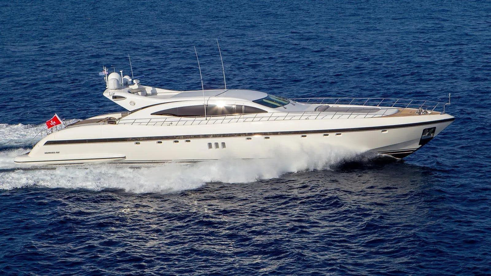 a white yacht in the water aboard COSMOS I Yacht for Sale