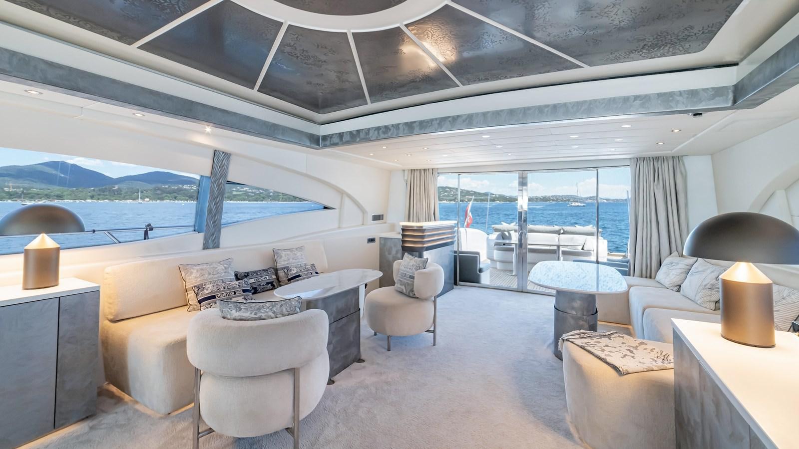 a living room with a large window aboard COSMOS Yacht for Sale