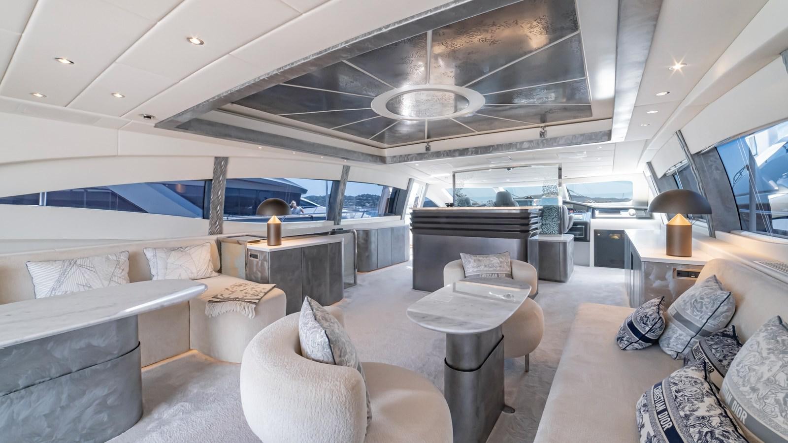 a living room with a large window aboard COSMOS Yacht for Sale