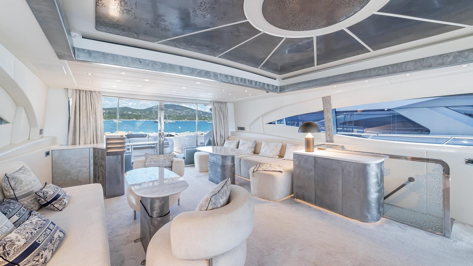 a living room with a large glass window aboard COSMOS Yacht for Sale