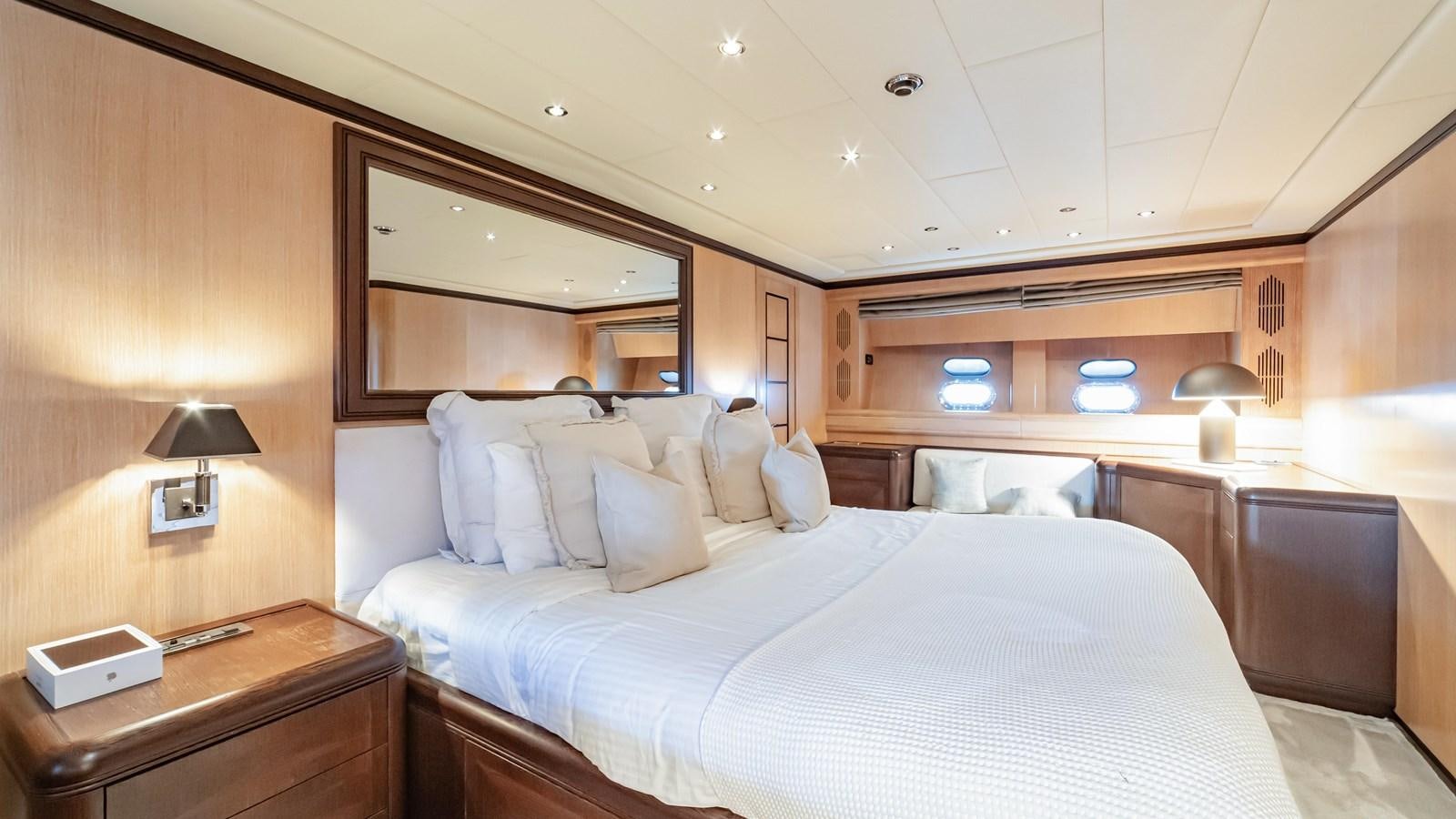 a hotel room with two beds aboard COSMOS Yacht for Sale