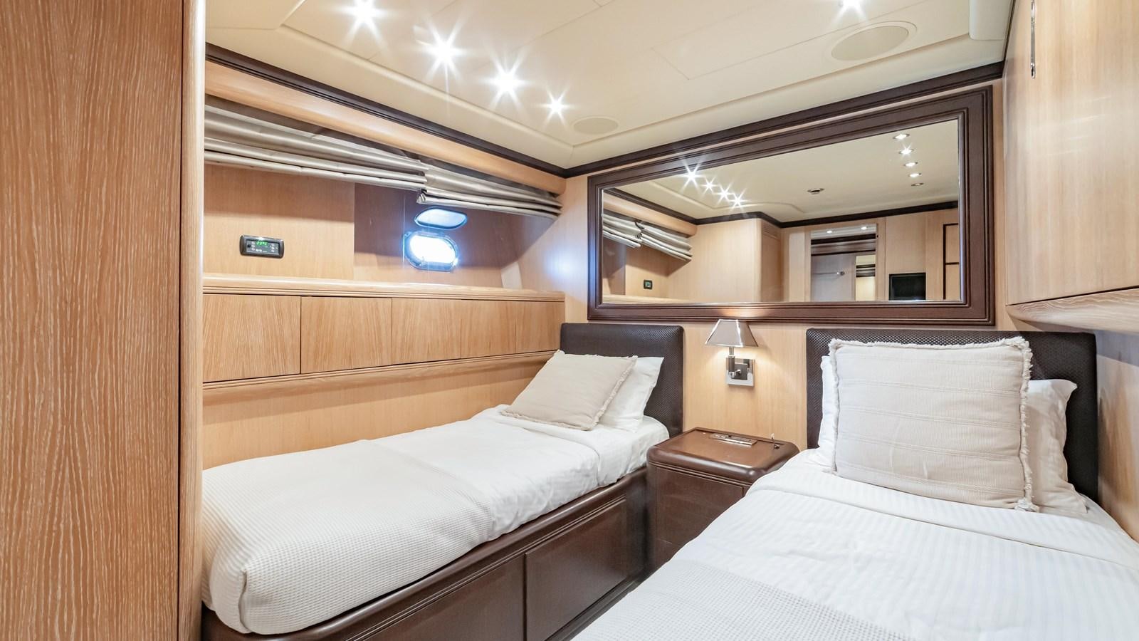 a room with two beds aboard COSMOS Yacht for Sale