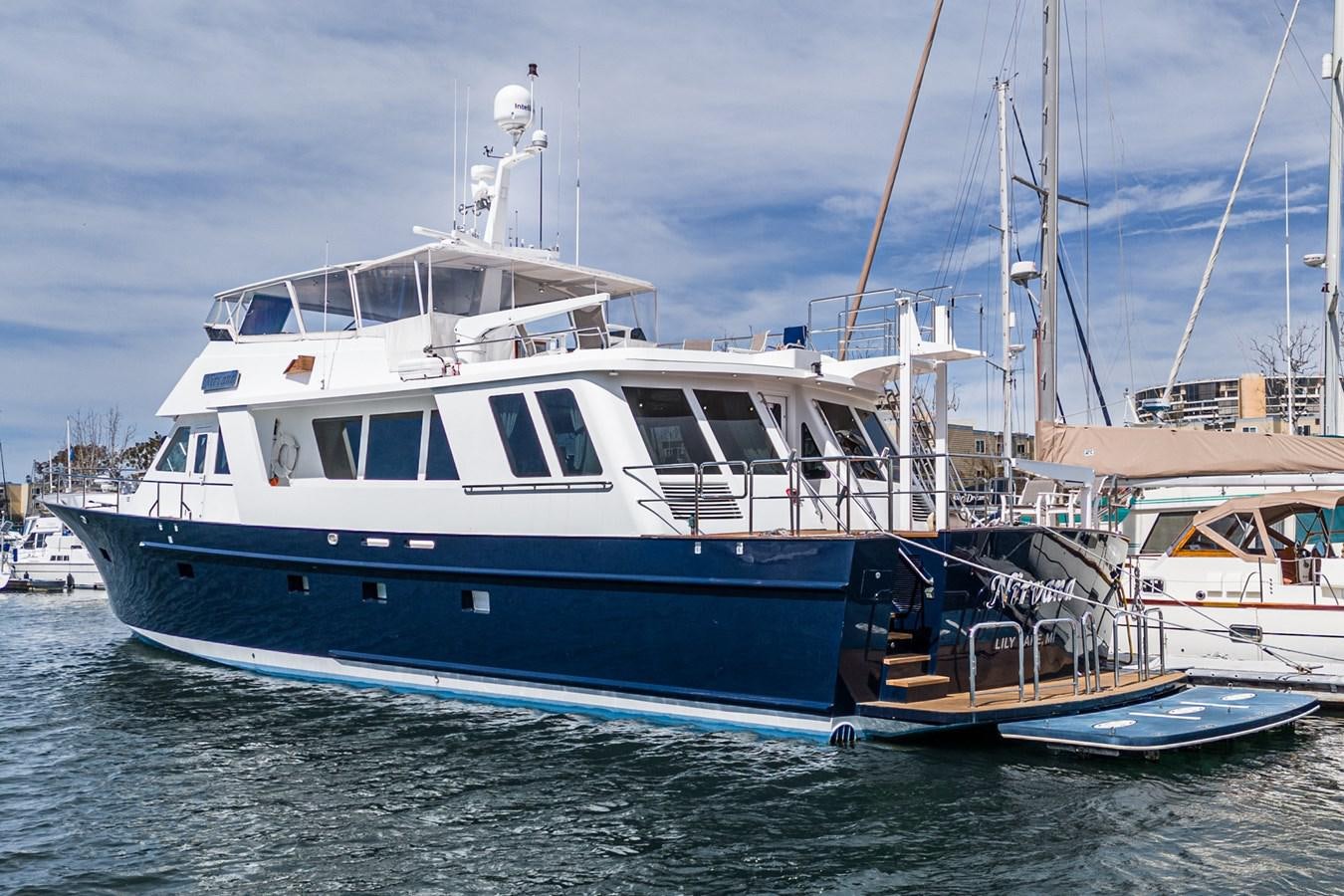 a boat docked at a pier aboard NIRVANA Yacht for Sale