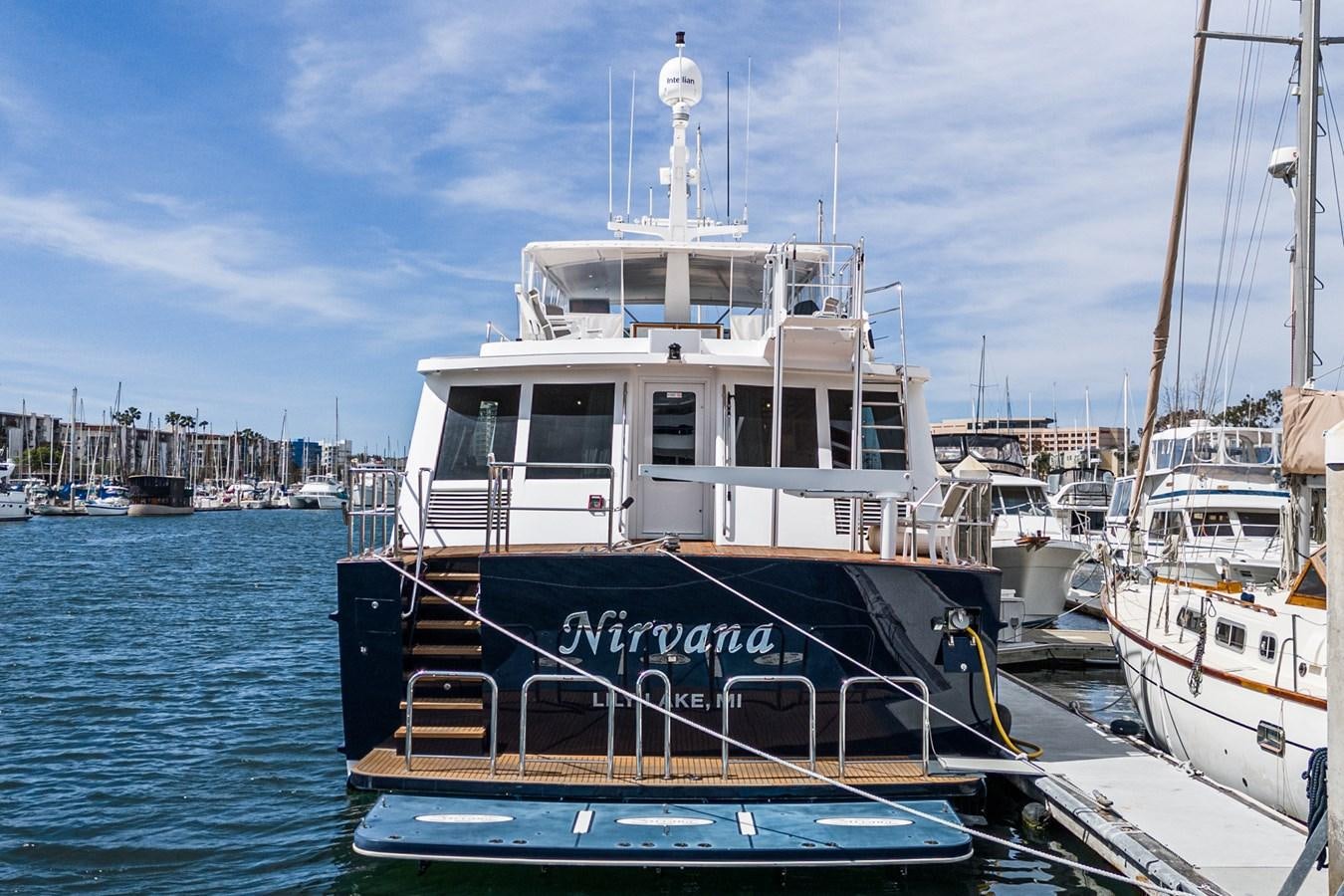 a boat docked at a pier aboard NIRVANA Yacht for Sale