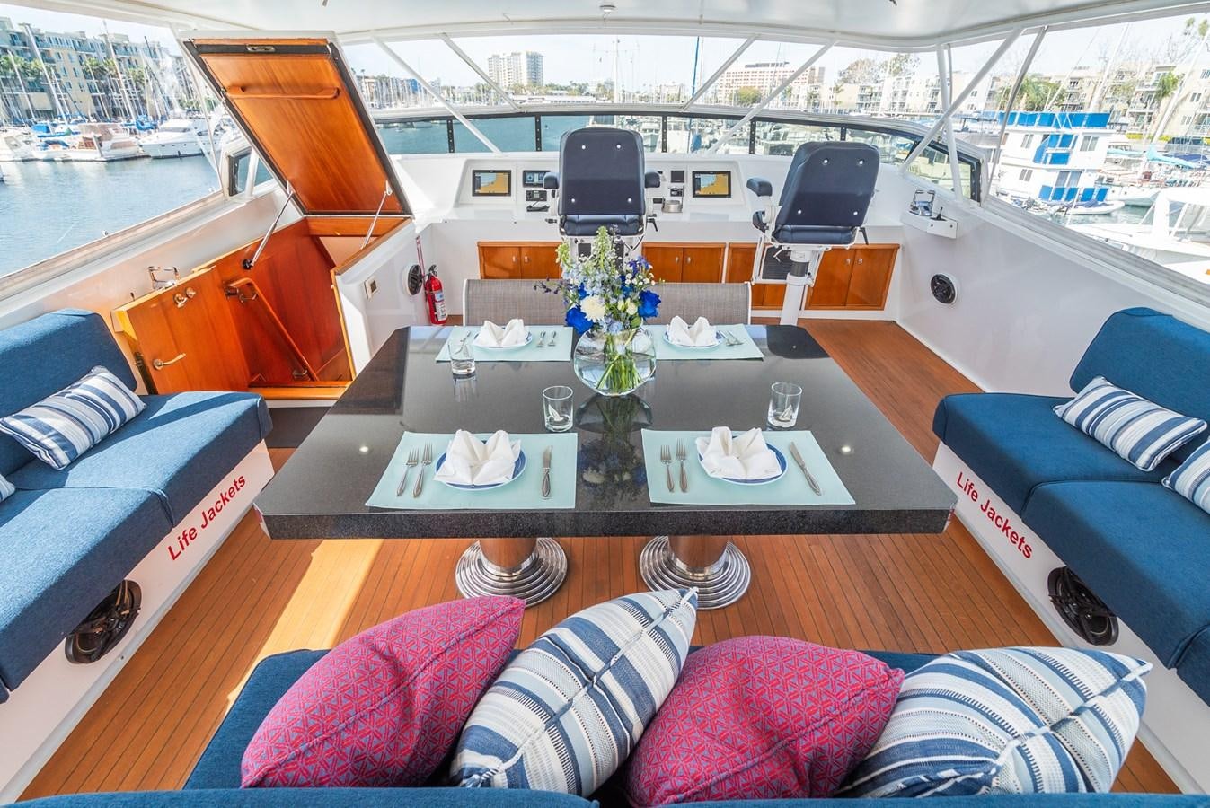 a boat with a table and chairs aboard NIRVANA Yacht for Sale