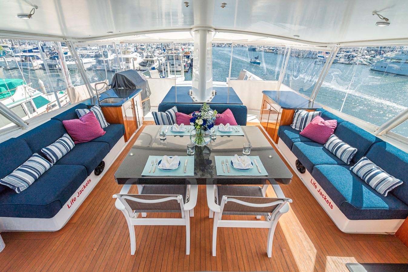 a room with a table and chairs aboard NIRVANA Yacht for Sale