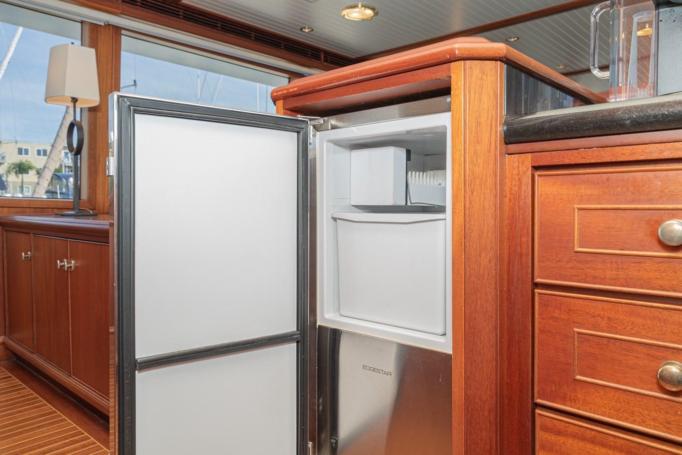 a room with wooden cabinets aboard NIRVANA Yacht for Sale