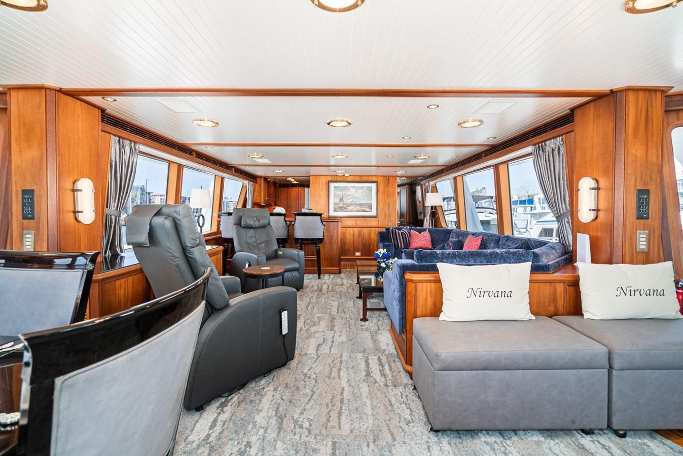 a living room with leather couches aboard NIRVANA Yacht for Sale