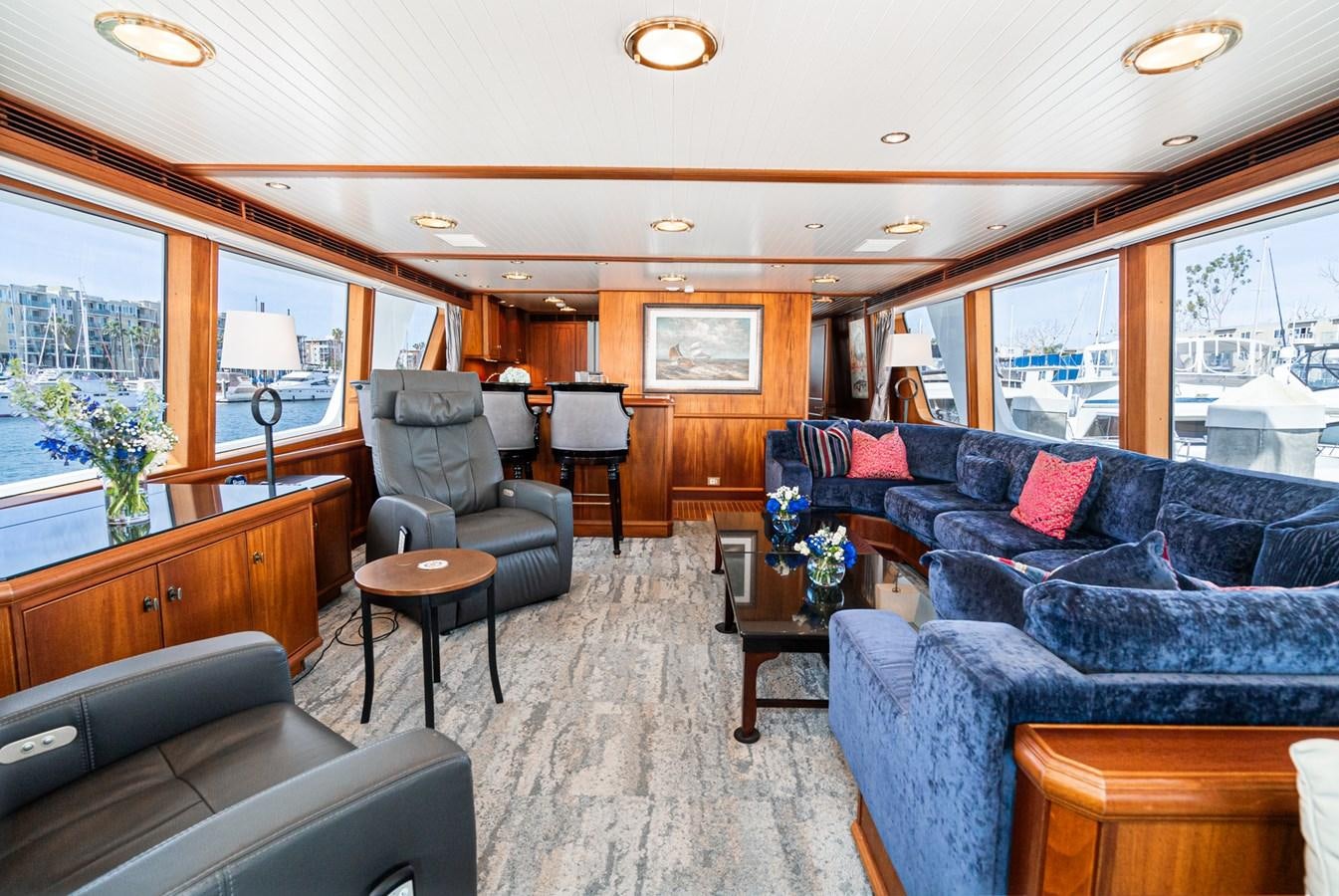 a living room with leather couches aboard NIRVANA Yacht for Sale