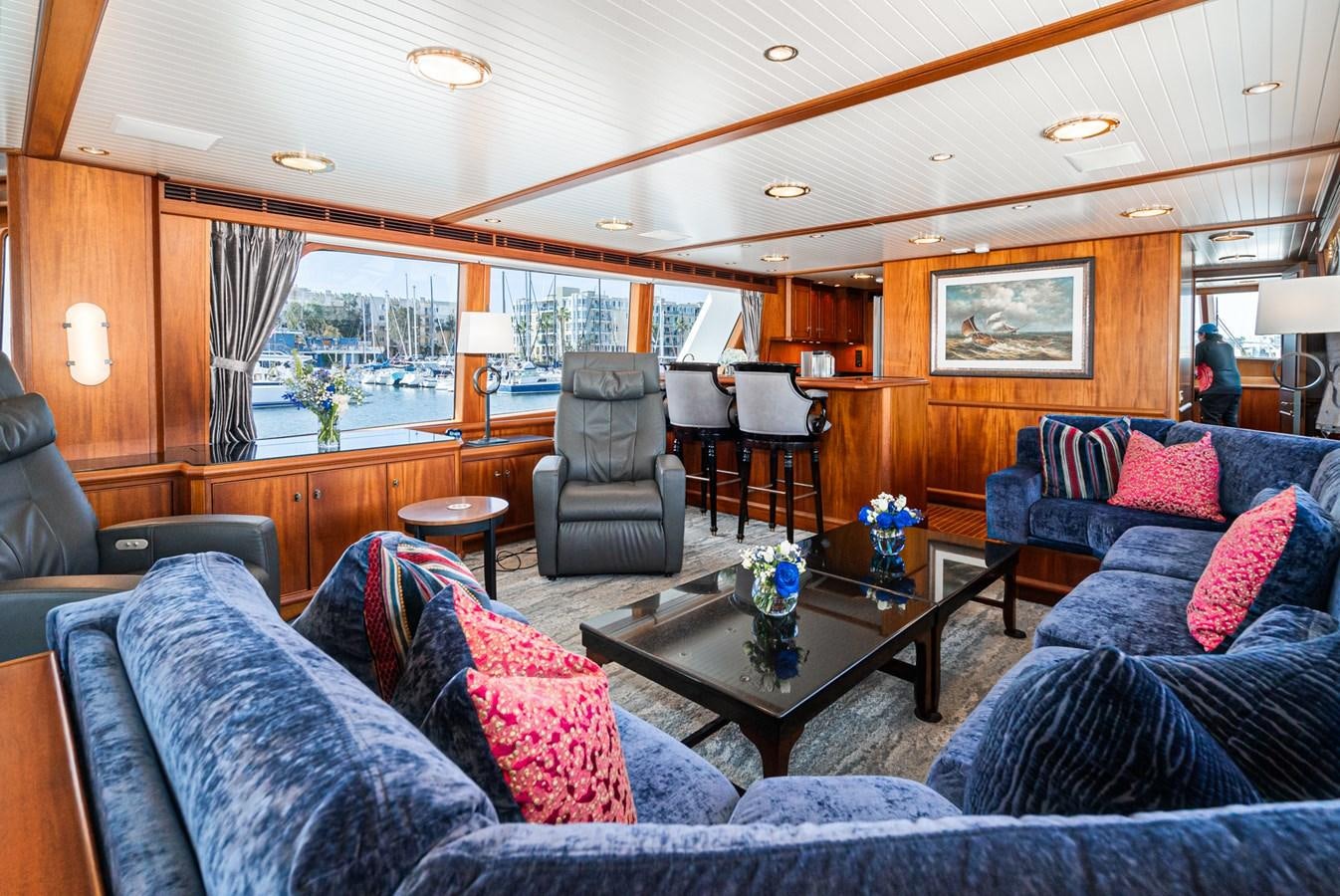 a living room with a large window aboard NIRVANA Yacht for Sale