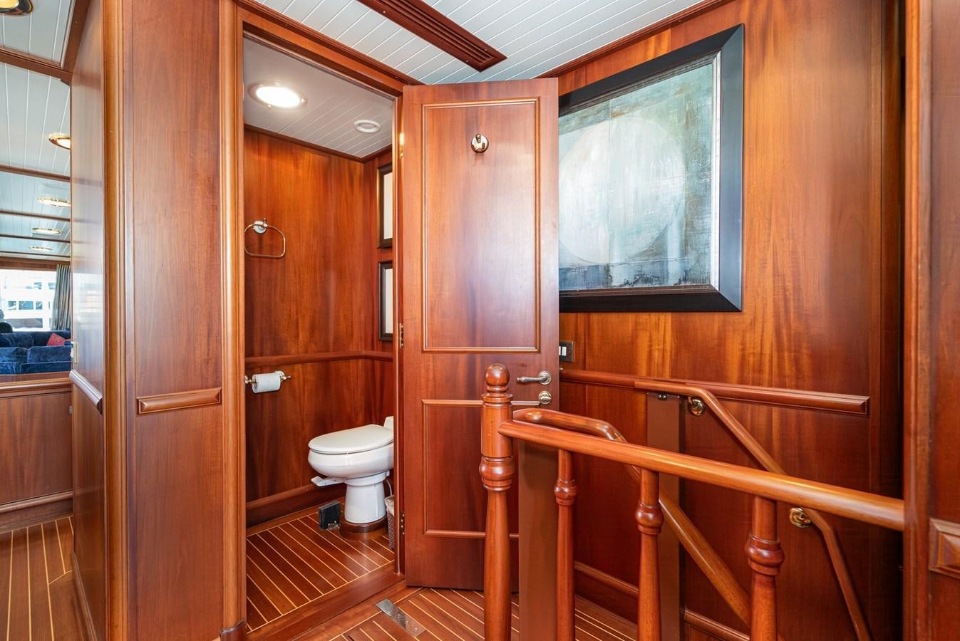 a bathroom with wooden walls aboard NIRVANA Yacht for Sale