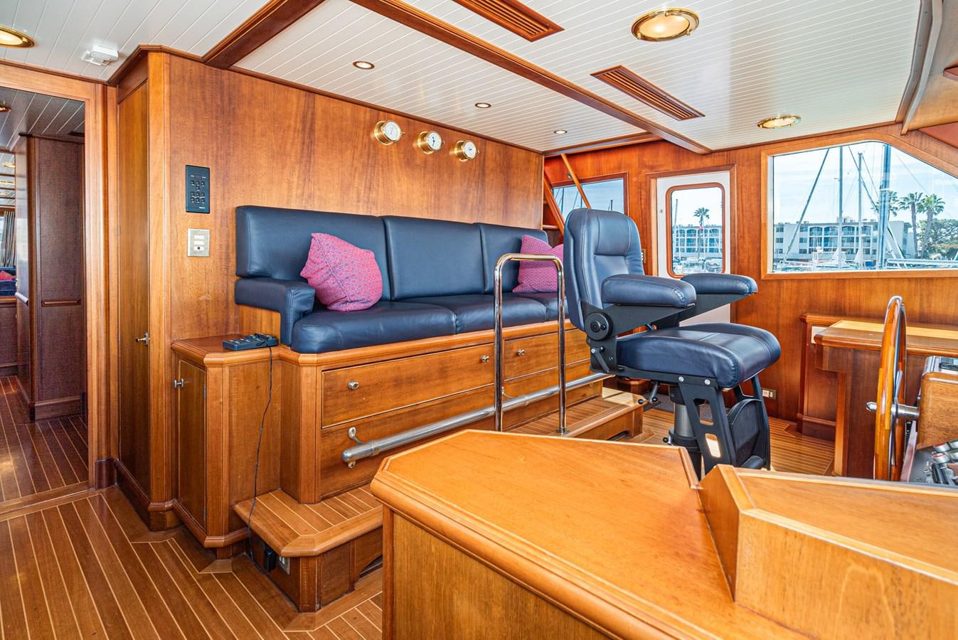 a room with a couch and a table aboard NIRVANA Yacht for Sale