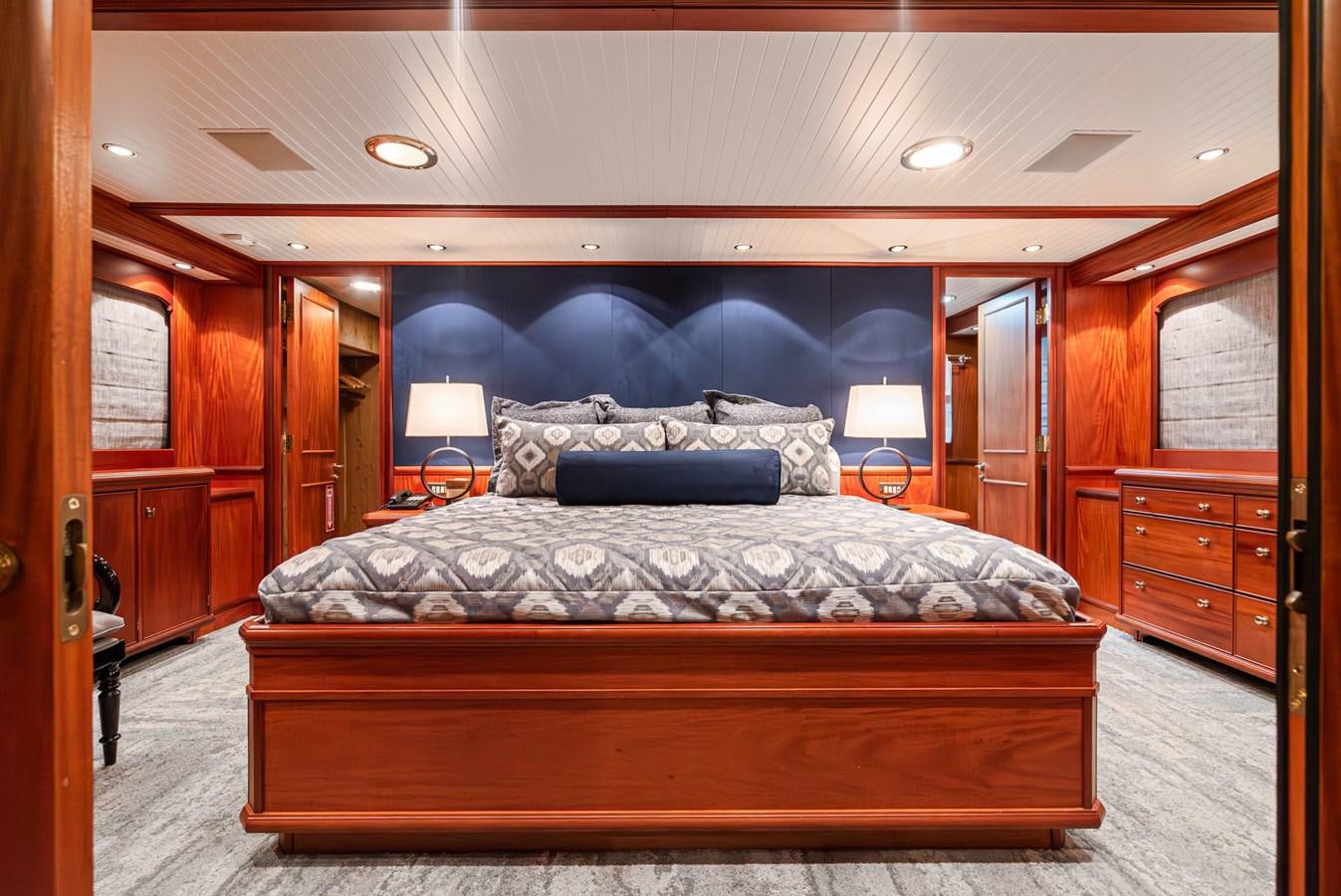 a large bed in a room aboard NIRVANA Yacht for Sale