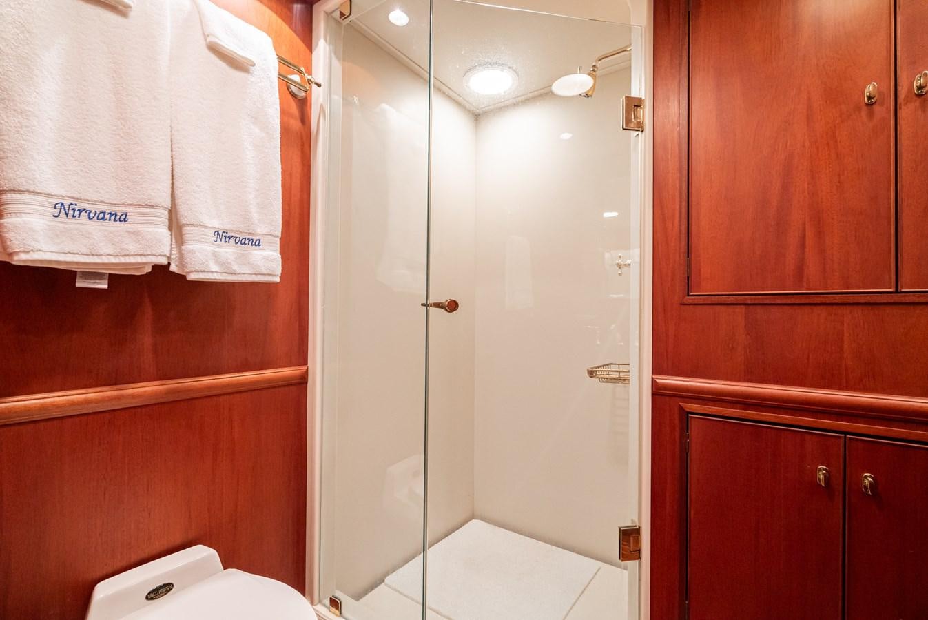 a bathroom with a shower and a sink aboard NIRVANA Yacht for Sale