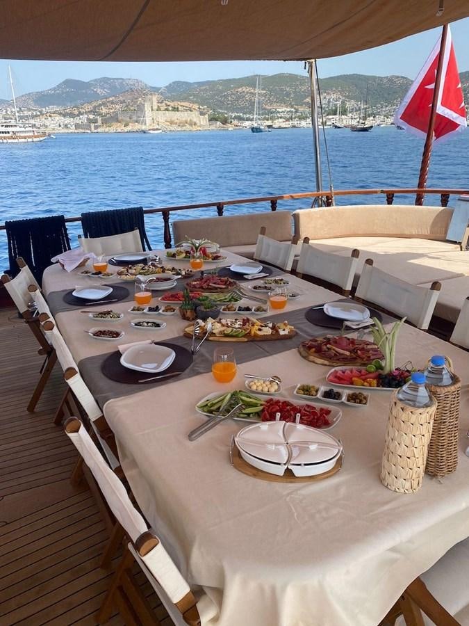 a table with food on it aboard QUEEN OF DATCA Yacht for Sale
