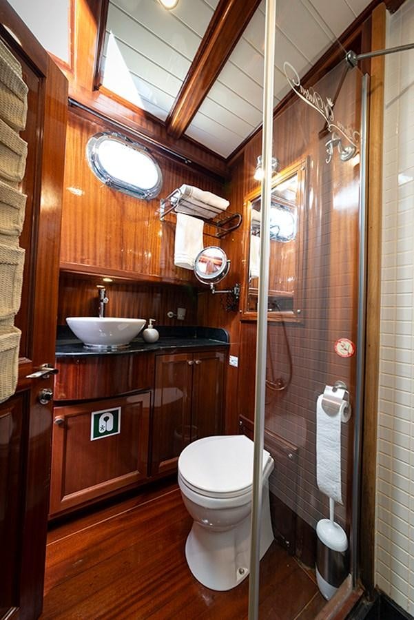 a bathroom with a toilet and sink aboard QUEEN OF DATCA Yacht for Sale