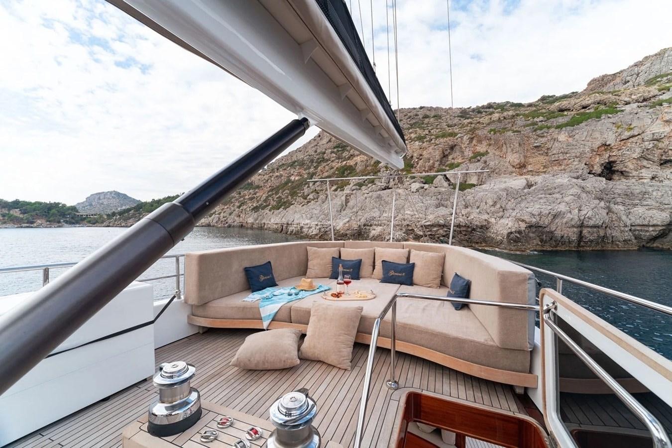 a deck with a laptop on it aboard CUSTOM MOTORSAILOR Yacht for Sale