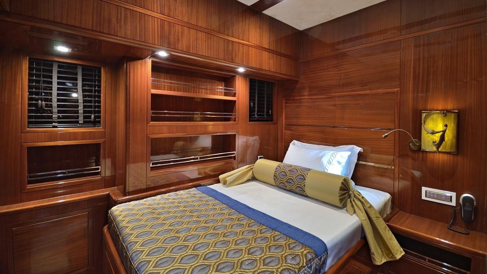 a couple of beds in a wooden room aboard CUSTOM MOTORSAILOR Yacht for Sale
