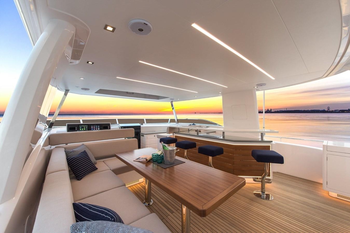 a room with a table and chairs aboard HORIZON Yacht for Sale