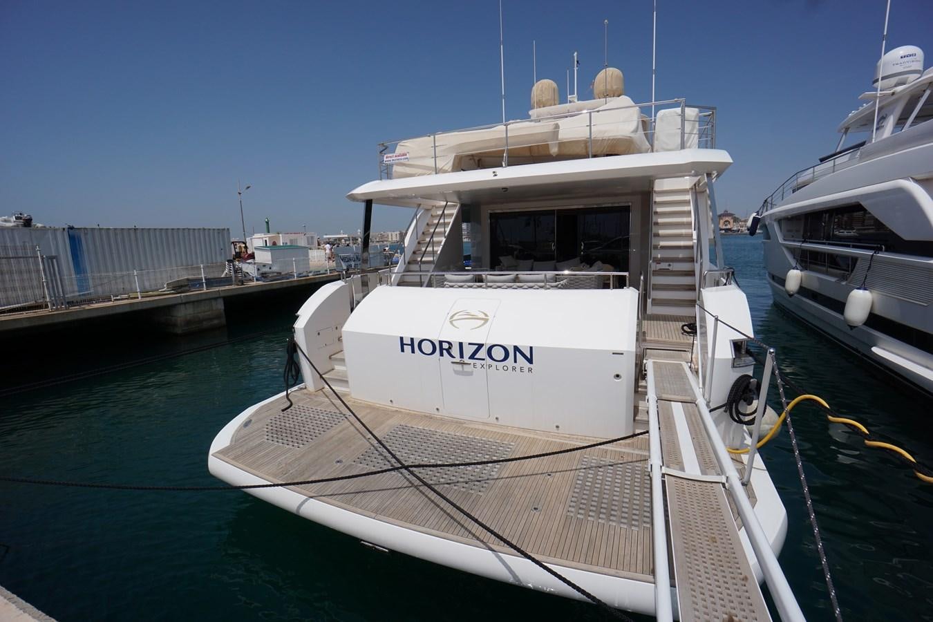a boat docked at a pier aboard HORIZON Yacht for Sale