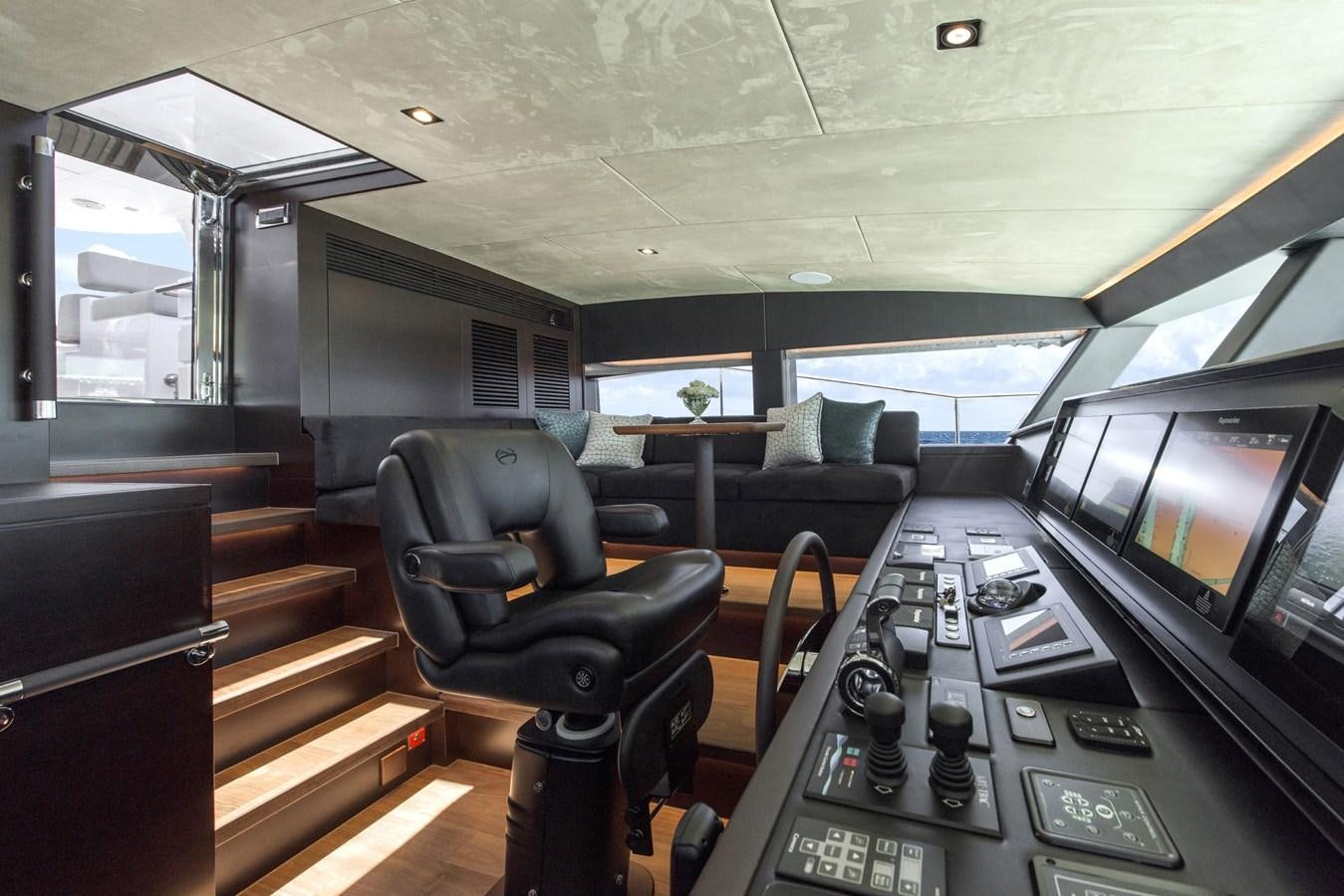 inside of a vehicle with a desk and chairs and a computer aboard HORIZON Yacht for Sale